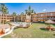 Lush backyard with a community hot tub, picnic tables with shade umbrellas, surrounded by tropical landscaping at 12760 Indian Rocks Rd # 532, Largo, FL 33774