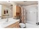 Bathroom features a light wood vanity, shower-tub combo with decorative curtain, and tiled walls at 12760 Indian Rocks Rd # 532, Largo, FL 33774