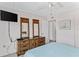 Well-lit bedroom with modern amenities, decorative mirrors, and a soothing ambiance at 12760 Indian Rocks Rd # 532, Largo, FL 33774