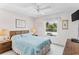 Light and airy bedroom with a comfortable bed, ceiling fan, and a view of the outdoors at 12760 Indian Rocks Rd # 532, Largo, FL 33774