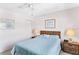 Cozy bedroom featuring a bed, nightstands with lamps, and neutral-toned walls at 12760 Indian Rocks Rd # 532, Largo, FL 33774