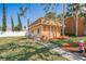 Clubhouse with a concrete walkway, bench, and manicured lawn at 12760 Indian Rocks Rd # 532, Largo, FL 33774