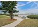 Community seating area with tables and chairs overlooking water view at 12760 Indian Rocks Rd # 532, Largo, FL 33774