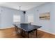 Game room featuring ping pong table with wood floor and modern lighting at 12760 Indian Rocks Rd # 532, Largo, FL 33774