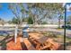 Community grilling area with stainless steel grill and picnic table at 12760 Indian Rocks Rd # 532, Largo, FL 33774