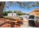 Community grilling area with stainless steel grill and picnic table at 12760 Indian Rocks Rd # 532, Largo, FL 33774