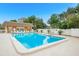 Exterior view of community pool and pool house; lounge chairs are neatly arranged at 12760 Indian Rocks Rd # 532, Largo, FL 33774