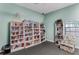 Reading room with floor-to-ceiling bookshelves and a comfortable armchair at 12760 Indian Rocks Rd # 532, Largo, FL 33774