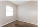 Simple bedroom with neutral-toned walls, carpeted flooring, and a bright window at 1322 E Ohio St, Plant City, FL 33563