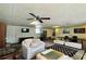 Spacious living room featuring a coffered ceiling, plush seating, and a large conference table at 1700 S Miller Rd, Valrico, FL 33594