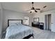 Bedroom featuring a ceiling fan, a dresser and closet at 18507 Country Crest Pl, Tampa, FL 33647