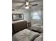 This charming bedroom features two beds, dresser, ceiling fan, and plenty of natural light at 1868 Shore S Dr # 608, South Pasadena, FL 33707