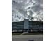 A multi-story condo building, boasting a clean, modern design and a well-maintained facade at 1868 Shore S Dr # 608, South Pasadena, FL 33707