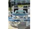 Community grilling area with picnic tables, offering a convenient outdoor cooking and dining option at 1868 Shore S Dr # 608, South Pasadena, FL 33707