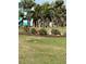 Lush outdoor landscaping featuring diverse tropical plants and grass, enhancing curb appeal at 1868 Shore S Dr # 608, South Pasadena, FL 33707