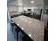Modern kitchen with white cabinets, granite countertops, and stainless steel appliances at 1868 Shore S Dr # 608, South Pasadena, FL 33707