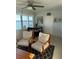 Living room with cozy seating, a view of the water, and a dining table at 1868 Shore S Dr # 608, South Pasadena, FL 33707