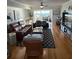 Cozy living room featuring hardwood floors, comfortable sofas, and bright, natural light at 1868 Shore S Dr # 608, South Pasadena, FL 33707