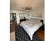 Bright main bedroom featuring a ceiling fan, mirrored closet doors, and stylish patterned rug at 1868 Shore S Dr # 608, South Pasadena, FL 33707