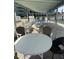 Outdoor patio space with picnic tables and Adirondack chairs, great for outdoor dining and entertaining at 1868 Shore S Dr # 608, South Pasadena, FL 33707