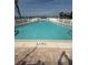 Refreshing outdoor pool surrounded by a white fence, providing a relaxing recreational space at 1868 Shore S Dr # 608, South Pasadena, FL 33707