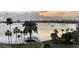 Breathtaking water view with palm trees and a dock, perfect for enjoying scenic sunsets at 1868 Shore S Dr # 608, South Pasadena, FL 33707