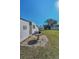 The patio area outside the home offering space for outdoor activities and relaxation in the backyard at 196 Philadelphia Blvd # 10, Palm Harbor, FL 34684