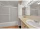 Functional bathroom features a shower/tub combo and a sink with storage at 196 Philadelphia Blvd # 10, Palm Harbor, FL 34684