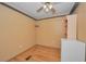 Cozy bedroom with a ceiling fan and a built in bookshelf at 196 Philadelphia Blvd # 10, Palm Harbor, FL 34684