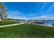 Community boat dock features access for boating and water activities, along with lush green lawn at 196 Philadelphia Blvd # 10, Palm Harbor, FL 34684
