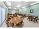 Recreation room with tables, chairs, and large window at 196 Philadelphia Blvd # 10, Palm Harbor, FL 34684