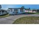 Inviting single-story home with covered parking and a convenient ramp for accessibility at 196 Philadelphia Blvd # 10, Palm Harbor, FL 34684