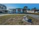 Charming single-story home featuring covered parking, a ramp, and a lovely front bench at 196 Philadelphia Blvd # 10, Palm Harbor, FL 34684