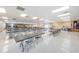 Large hall filled with tables and chairs, perfect for gatherings and events at 196 Philadelphia Blvd # 10, Palm Harbor, FL 34684