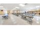 Open hall with tables and chairs, ideal for events and community activities at 196 Philadelphia Blvd # 10, Palm Harbor, FL 34684