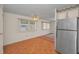 Open kitchen with stainless steel appliances and adjacent dining area at 196 Philadelphia Blvd # 10, Palm Harbor, FL 34684