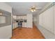 Open kitchen with stainless steel appliances and adjacent dining area at 196 Philadelphia Blvd # 10, Palm Harbor, FL 34684