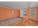 Inviting living room featuring wood floors and a view to the outside at 196 Philadelphia Blvd # 10, Palm Harbor, FL 34684