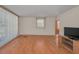 Bright living room with laminate wood flooring and large window at 196 Philadelphia Blvd # 10, Palm Harbor, FL 34684