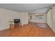 Cozy living room area with laminate wood flooring and traditional rug at 196 Philadelphia Blvd # 10, Palm Harbor, FL 34684
