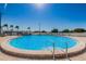 Inviting outdoor pool with clear water, surrounded by a spacious deck and comfortable lounge chairs at 196 Philadelphia Blvd # 10, Palm Harbor, FL 34684
