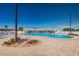 Large community pool with sun loungers and landscaped areas at 196 Philadelphia Blvd # 10, Palm Harbor, FL 34684
