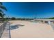 View from roof deck showing a beautiful pool and seating area surrounded by a white picket fence at 196 Philadelphia Blvd # 10, Palm Harbor, FL 34684