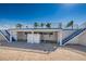 Pool area with stairs and bathrooms and a sign on the center door about no diving at 196 Philadelphia Blvd # 10, Palm Harbor, FL 34684