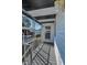 Porch area with covered entry at 196 Philadelphia Blvd # 10, Palm Harbor, FL 34684