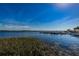 Scenic waterfront view showcasing the community dock and boat slips with lake access at 196 Philadelphia Blvd # 10, Palm Harbor, FL 34684