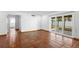 Living room with terracotta tile, recessed lighting, and sliding glass doors leading to the backyard at 1974 Valencia Way, Clearwater, FL 33764