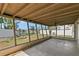 Outdoor living space offering a tranquil backyard view at 1974 Valencia Way, Clearwater, FL 33764