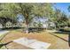 Beautiful park with a grill, benches, and mature trees at 22287 Blazing Star Run, Land O Lakes, FL 34637