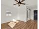 Bedroom with a ceiling fan, wood floors, and modern doors to the closet and en suite at 2921 67Th N Ln, St Petersburg, FL 33710